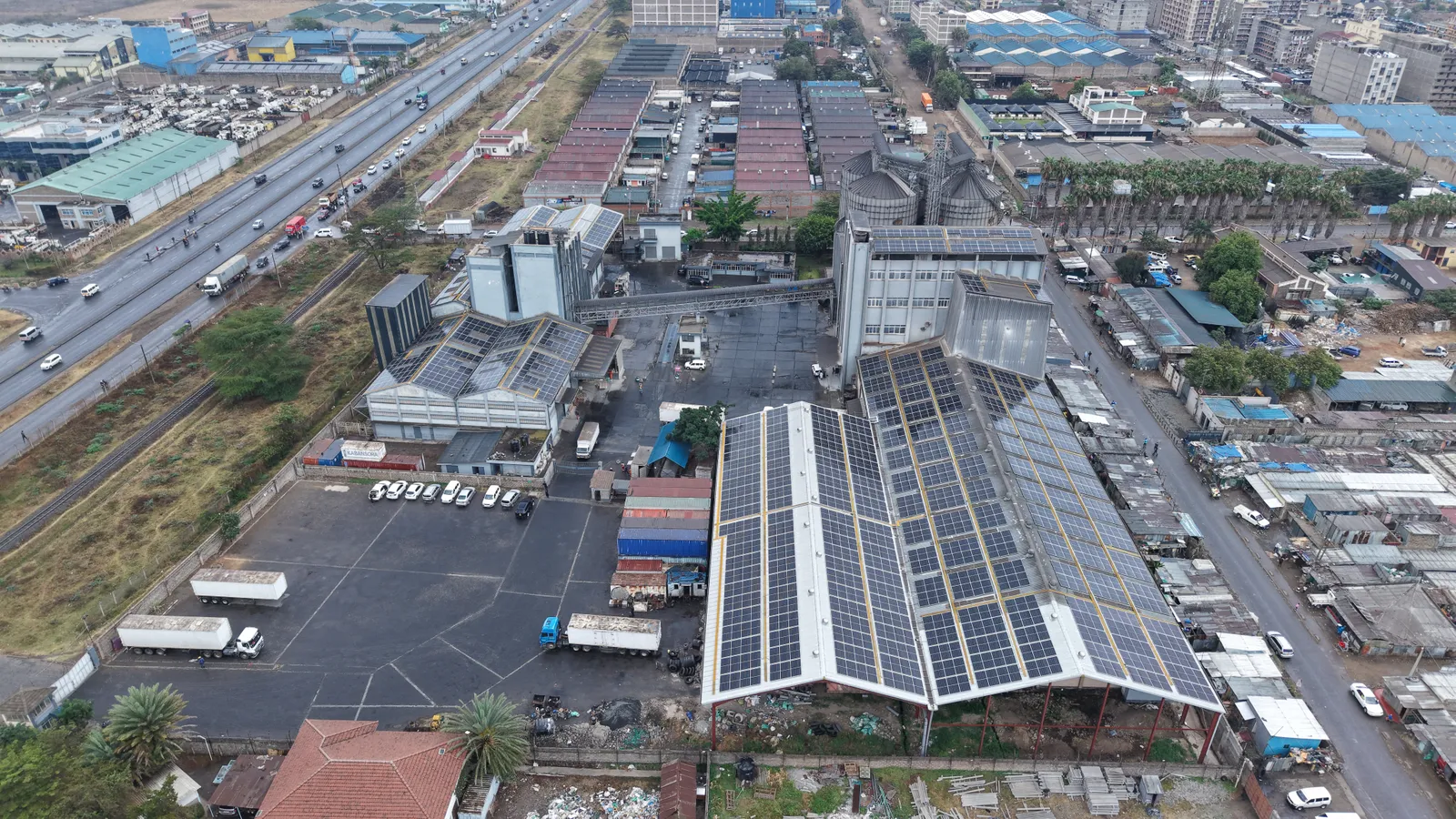 Aerial overview of the Kabansora Millers site with solar panels on the main mill roof